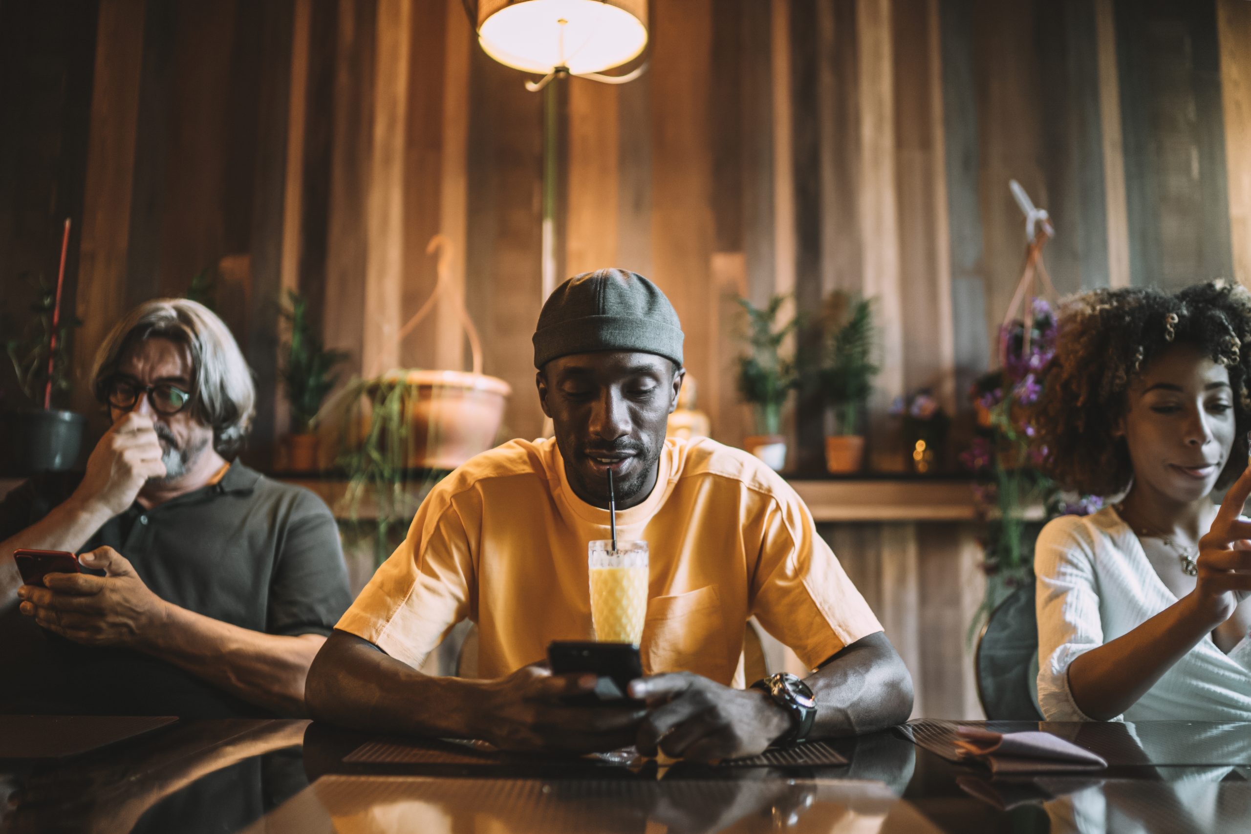 group of interracial friends dining and having fun together at a restaurant